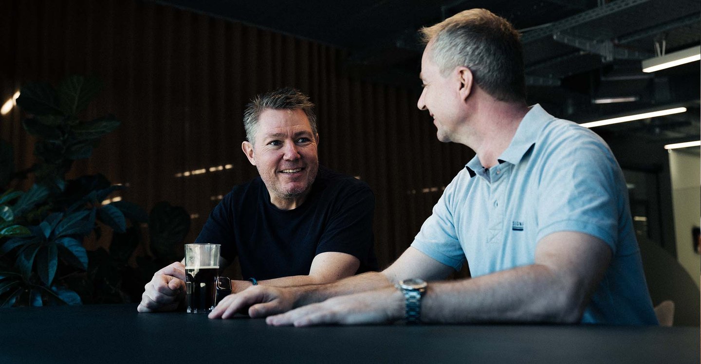 coworkers-talking-and-smilling