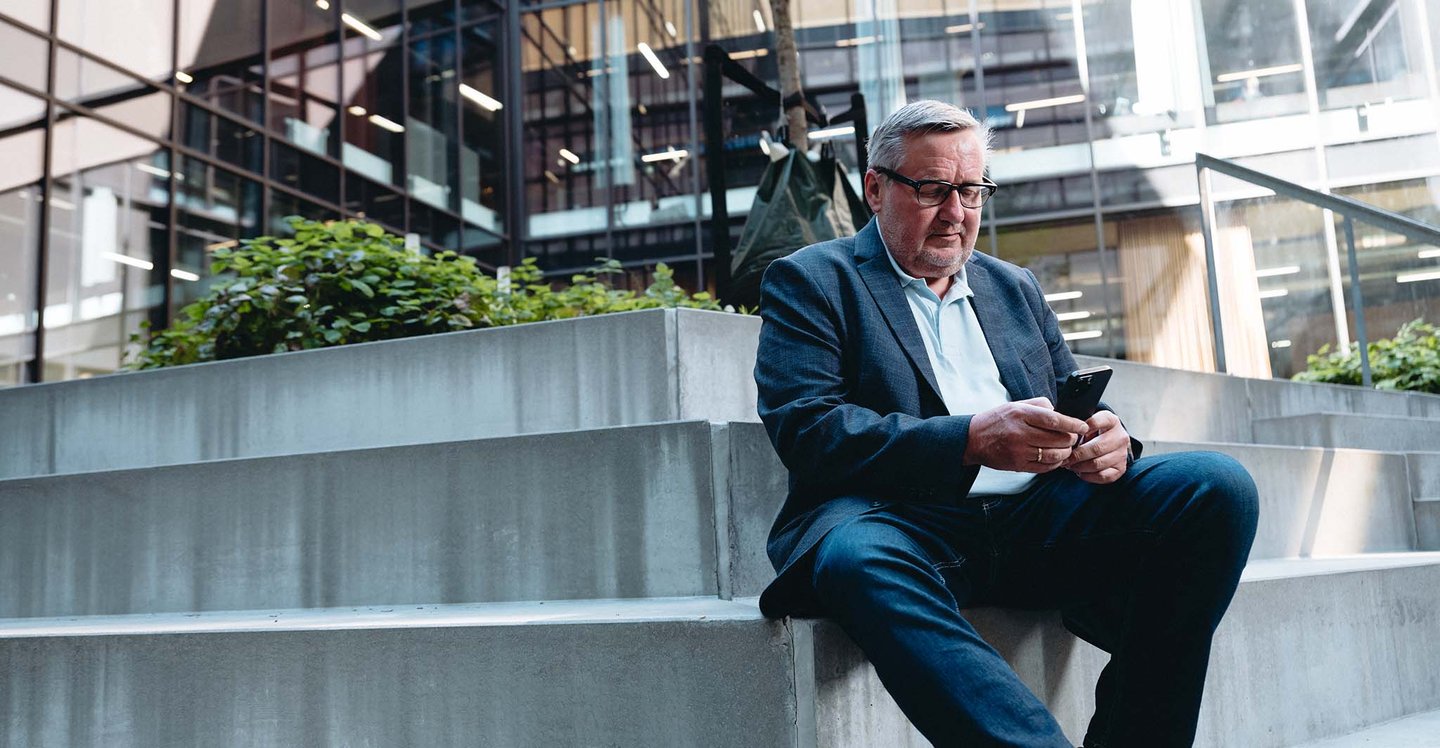 management-sitting-with-phone