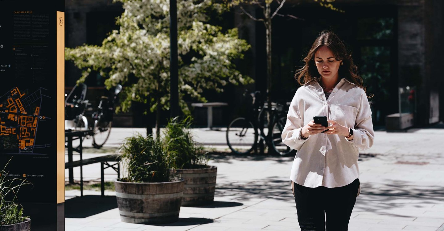woman-looking-at-her-phone-outside