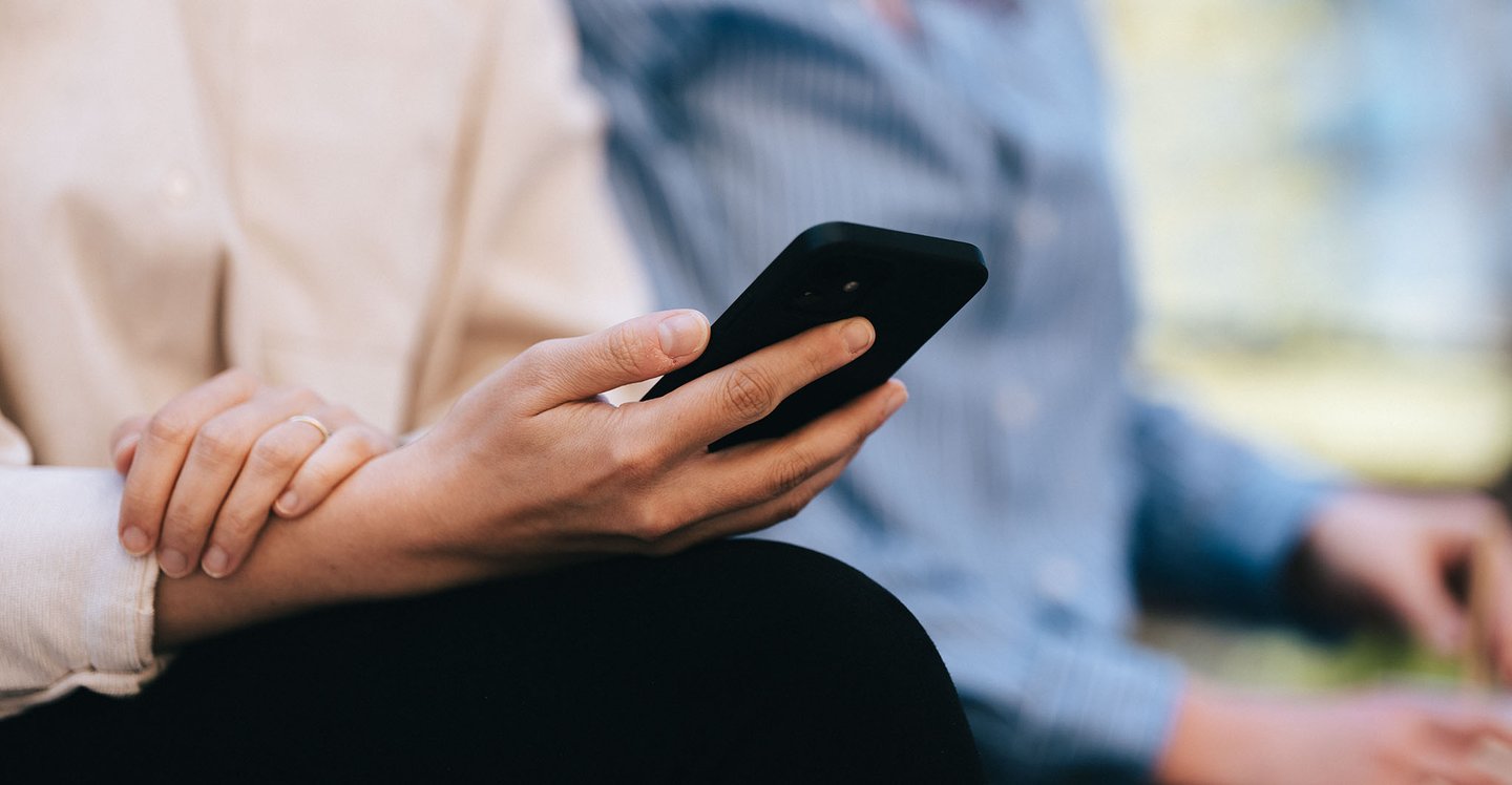 womans-hand-holding-phone
