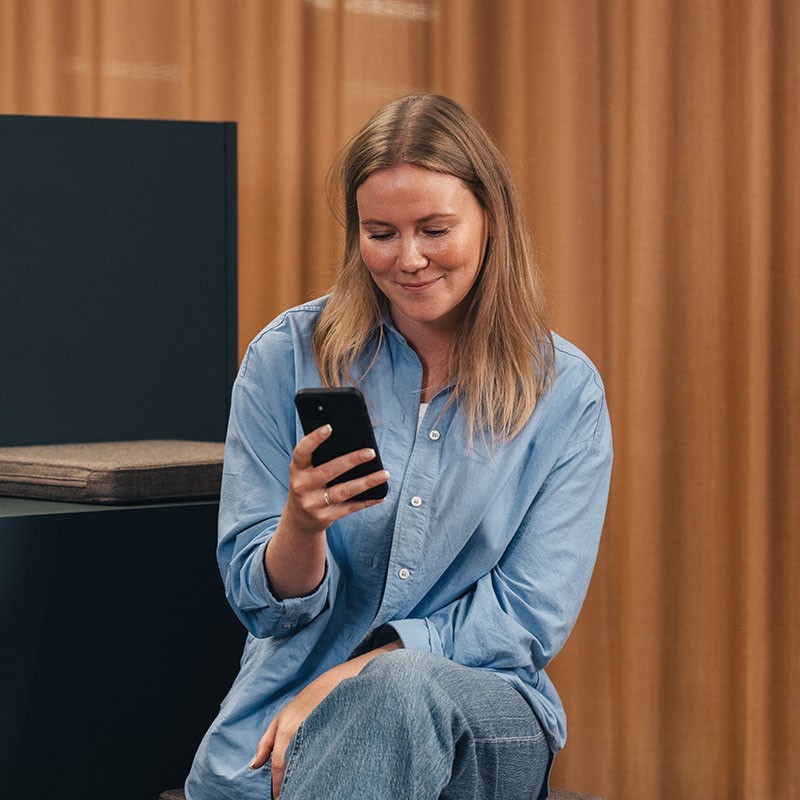 woman-sitting-with-phone