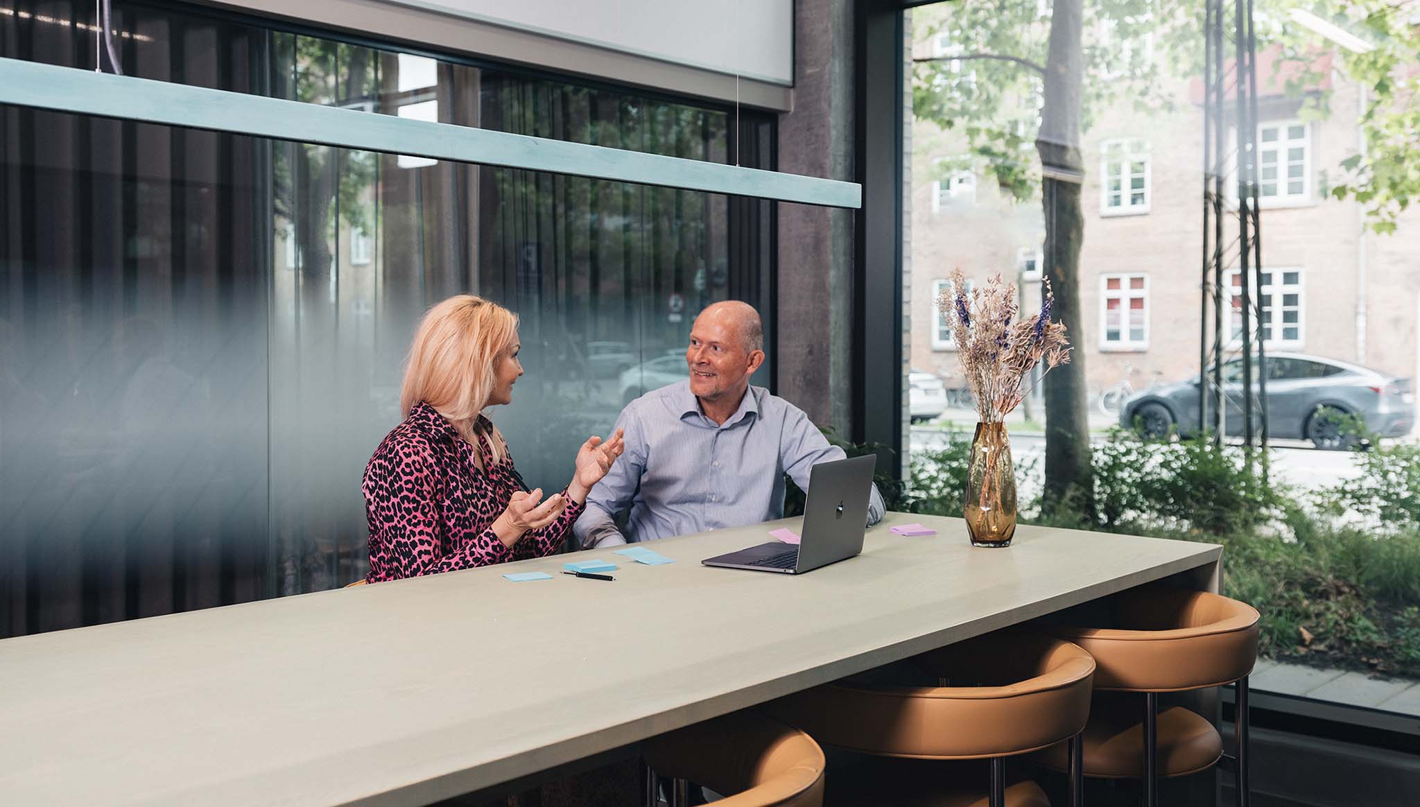 coworkers-talking-in-meeting-room